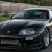 Schwarzer getunter Toyota Supra mit Fahrer auf einer deutschen Straße als Symbolbild für Fahrzeugtuning und Zulassung